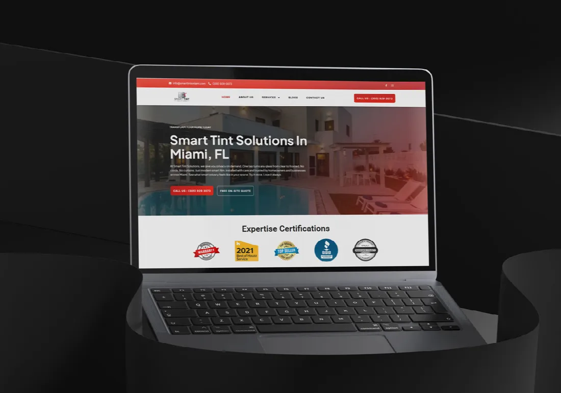 Smart Tint Solutions site shown on a laptop