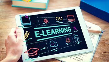 Tablet displaying E-Learning icons for online education